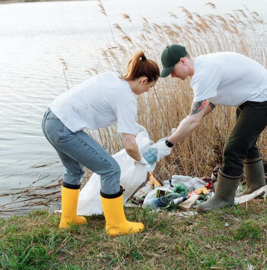 People cleaning a pond